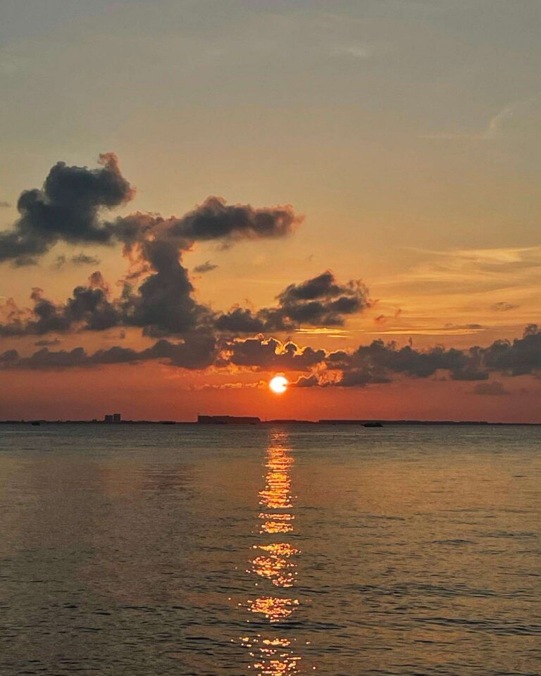 Orange sunset over the Caribbean sea seen from the boat