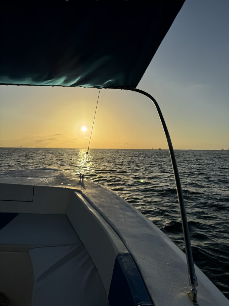Sunset over the Caribbean seen from the Isla Sea Tours boat