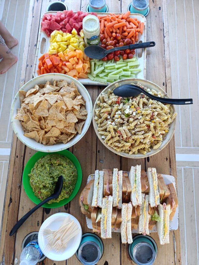 Snacks, fruit and drinks spread served on board